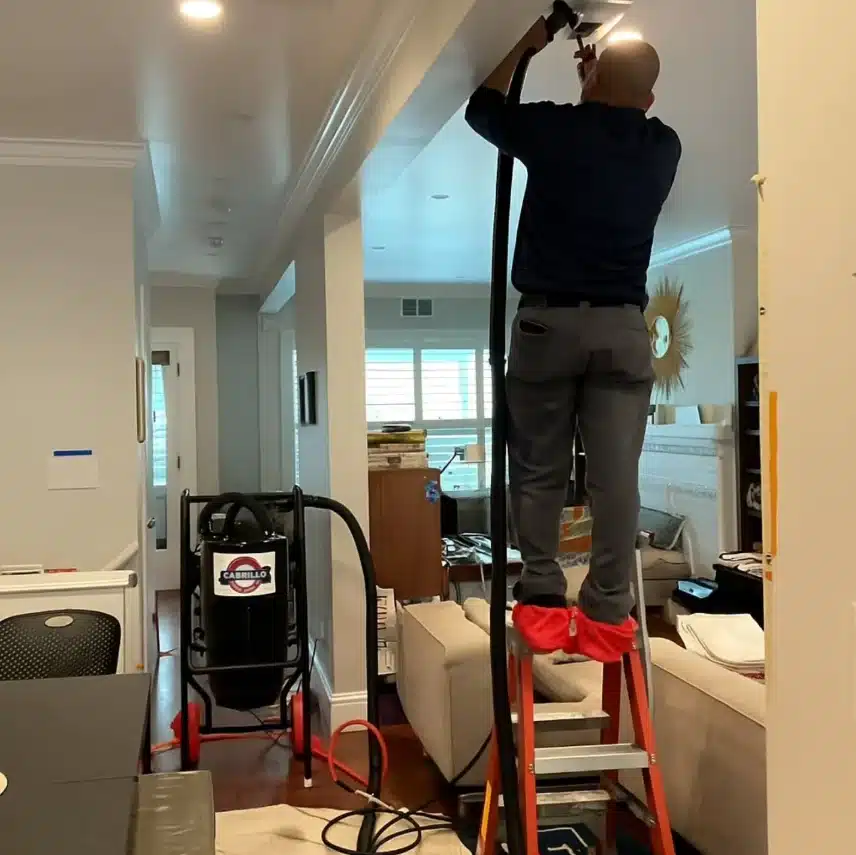annual HVAC maintenance technician inspecting home system