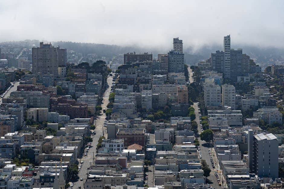 San Francisco fog rolling over residential rooftops in a Bay Area neighborhood - how bay area climate affects your hvac and